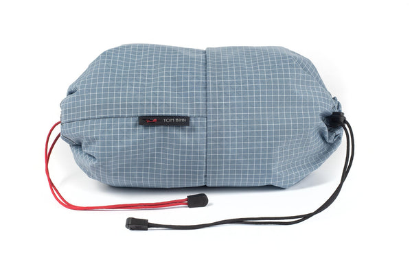 An Aeronaut 30 Travel Laundry Stuff Sack in Tidal (pale blue with white grid) 200 Halcyon.